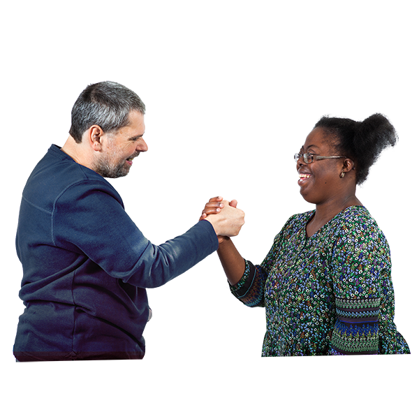 Two people clasp hands while looking at each other