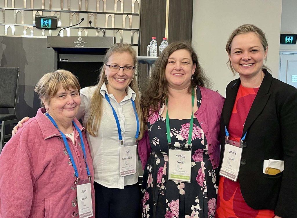 Four members of the GeneEQUAL team pose in the foyer